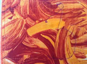 The back of Cherries, showing minimal stitching on the back, due to it being thread painted, THEN quilted to the backing. (I have no idea why I used purple thread!)